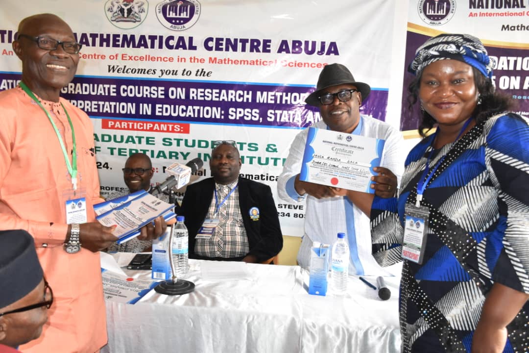 From L - R: Prof Steve Oluwaniyi, Coordinator, Mathematical Sciences Education Program, MSEP, NMC, Abuja. Prof Promise Mebine, DG, NMC and a Participant receiving her certificate at the closing ceremony of a two week Foundation Post Graduate Course on Research Methodology, Data Analysis and Interpretation in Education.