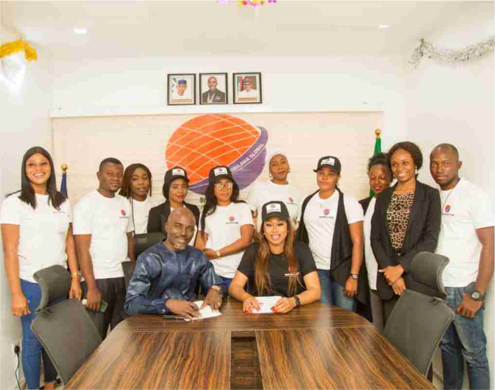 Staff of Nuel Osilama Global posed with their Brand Ambassador at the company’s office