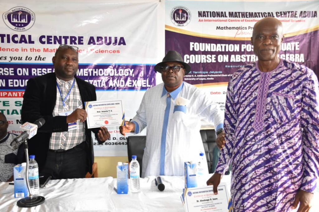 From L - R: Prof Temitope Jaiyeola from University of Lagos. Prof Promise Mebine, DG, NMC and Prof James Ajie, Coordinator, Mathematics Program, NMC, Abuja at the Closing Ceremony of a two week Foundation Post Graduate Course on Abstract Algebra.